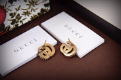 Luxuriöse Ohrstecker mit Doppel G und Strass