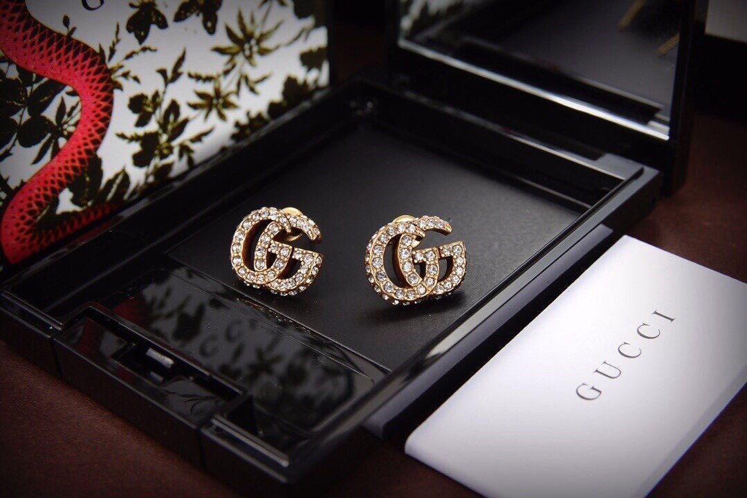 Luxuriöse Ohrstecker mit Doppel G und Strass