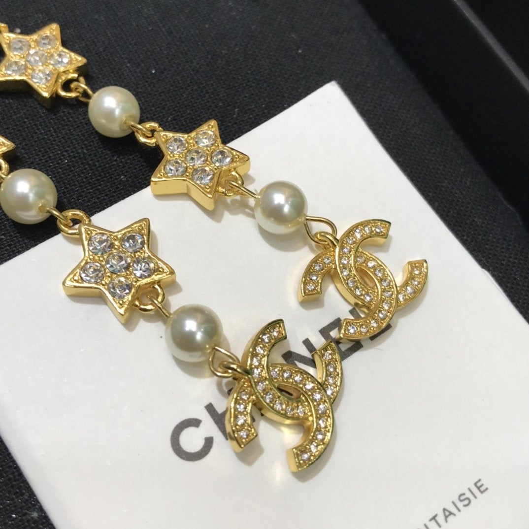Luxuriöse Ohrringe mit Perlen-Strass-Stern-Anhänger