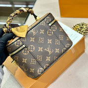Luxuriöse Bucket Bag Handtasche aus bedrucktem Leder